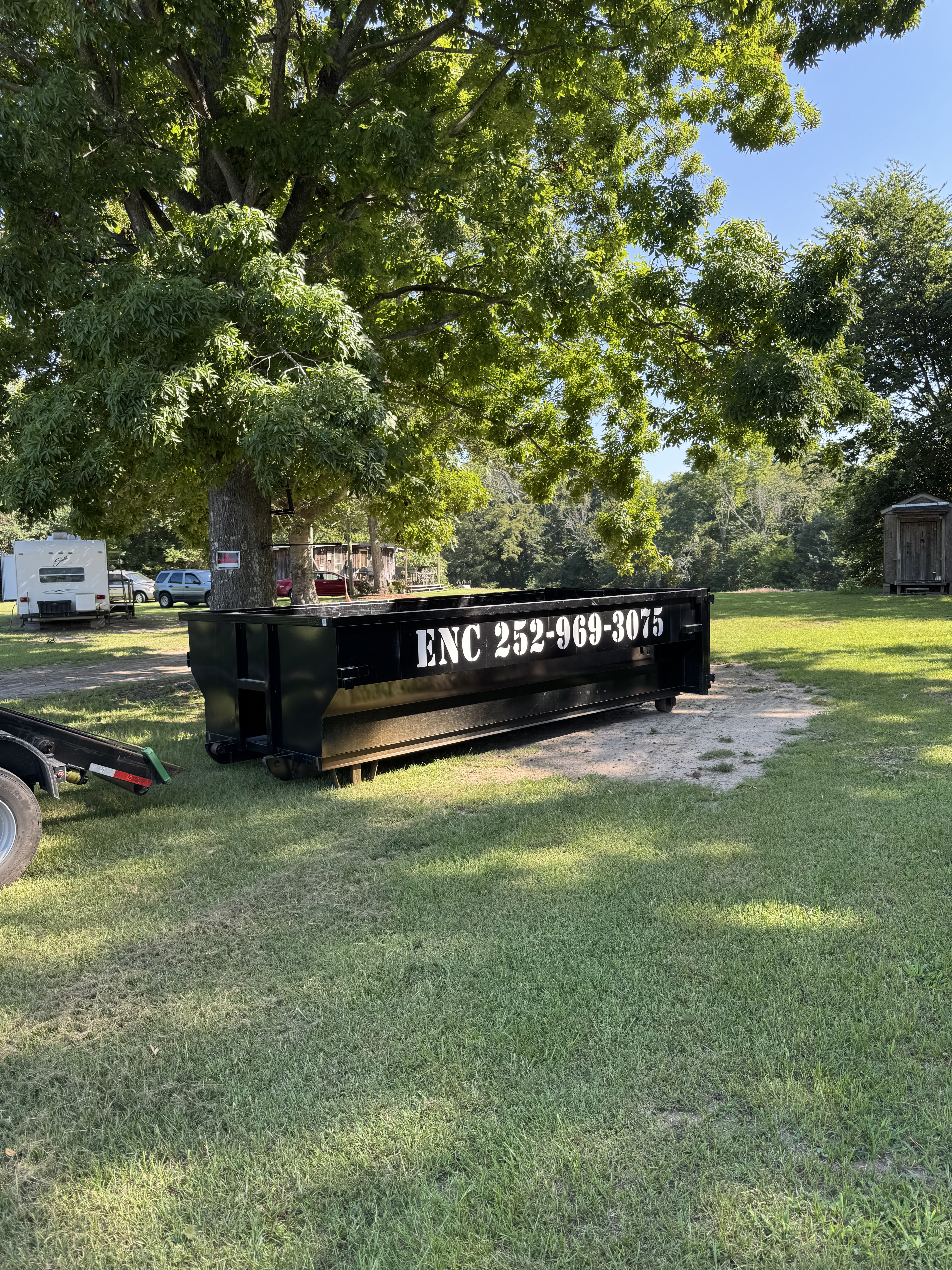 ENC Dumpster rental service - driveway protection included